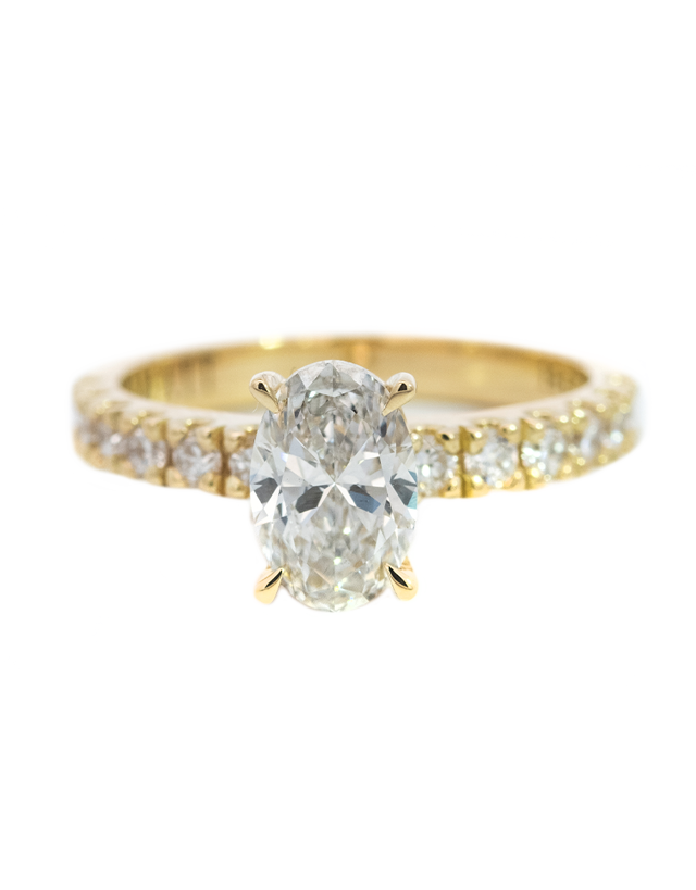 1CT Total Weight - Oval Diamond ring with diamonds on the shank set in 18CT Yellow gold