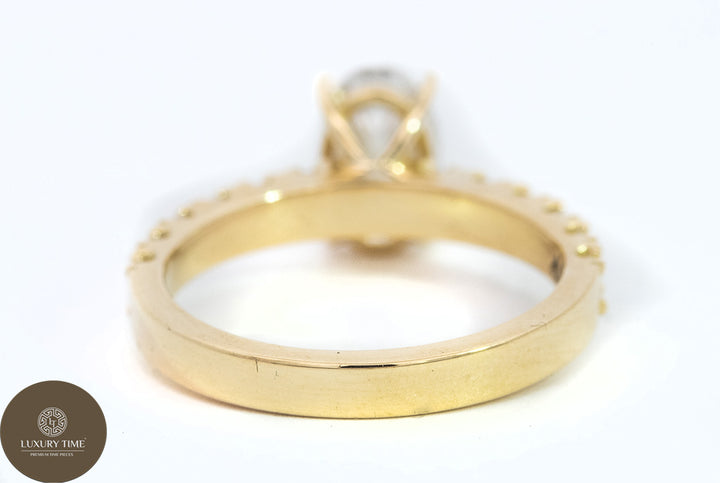 1CT Total Weight - Oval Diamond ring with diamonds on the shank set in 18CT Yellow gold