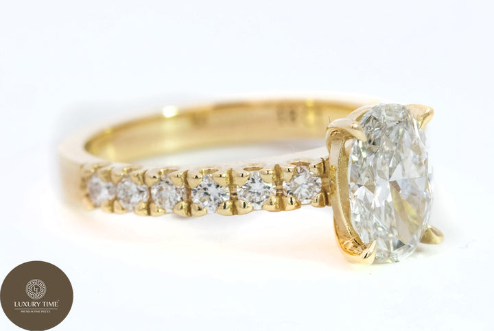 1CT Total Weight - Oval Diamond ring with diamonds on the shank set in 18CT Yellow gold