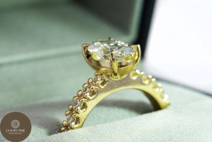 1CT Total Weight - Oval Diamond ring with diamonds on the shank set in 18CT Yellow gold