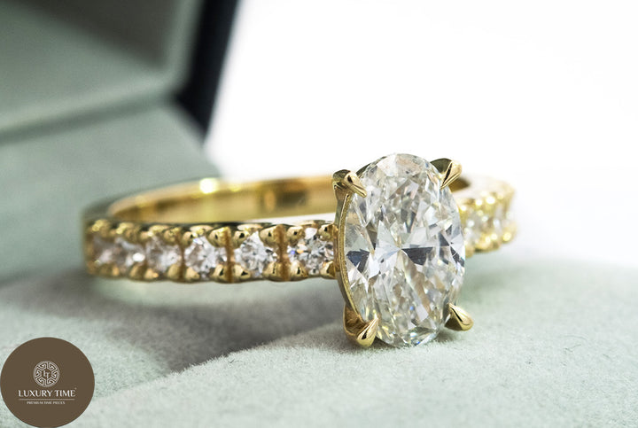 1CT Total Weight - Oval Diamond ring with diamonds on the shank set in 18CT Yellow gold